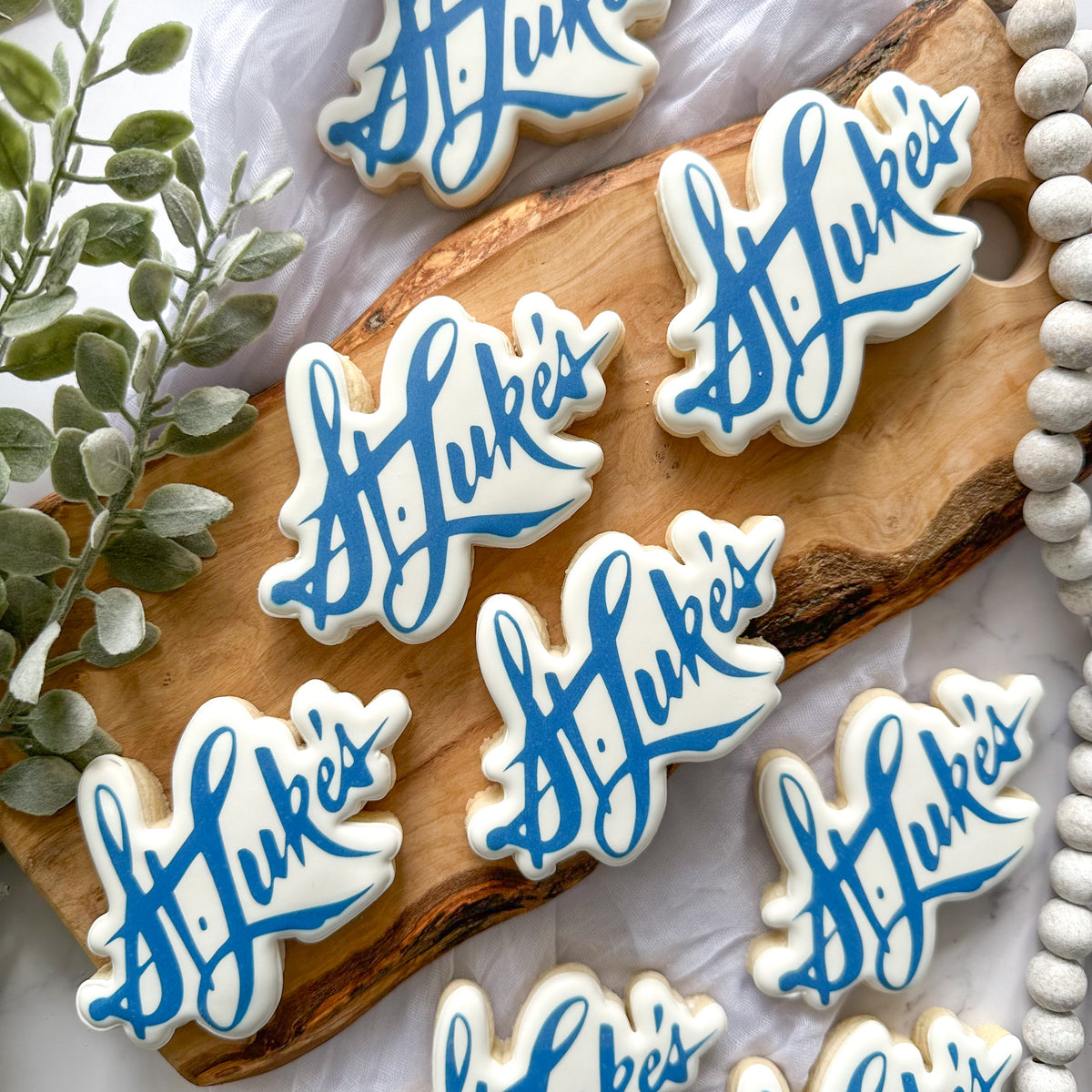 Custom St. Luke's logo cookies for a corporate event in Tampa